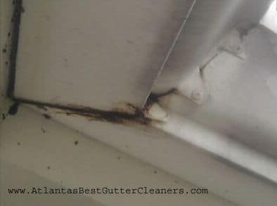 The seam of this gutter is leaking.  Atlanta's Best Gutter Cleaners can fix it.